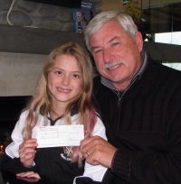 Sir Richard Hadlee presents Imke with a Trust Grant cheque
